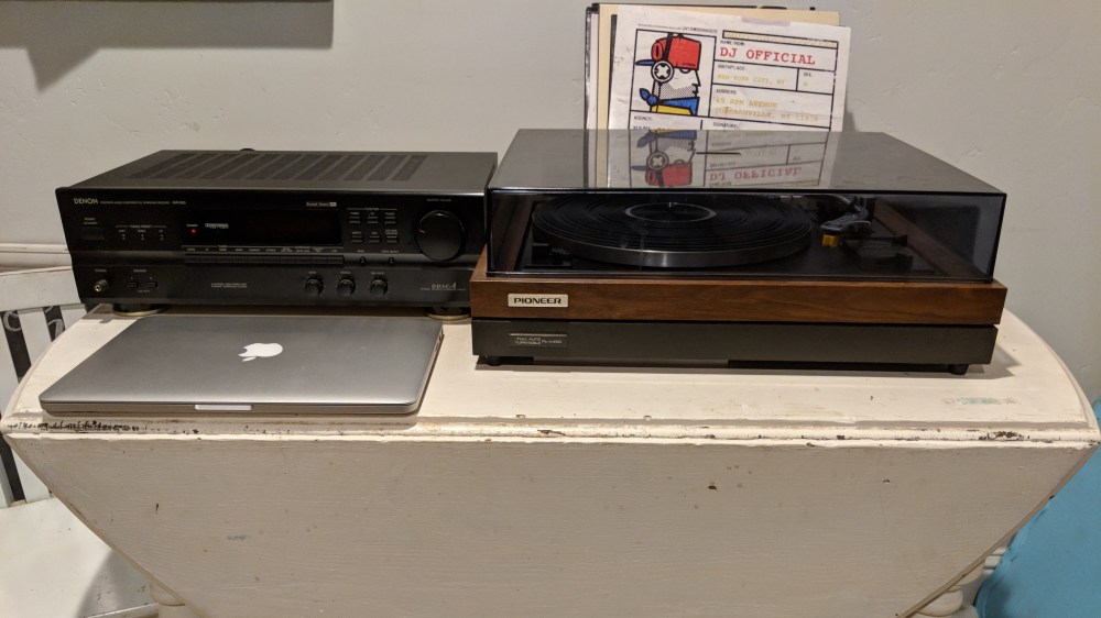 Macbook pro next to record player